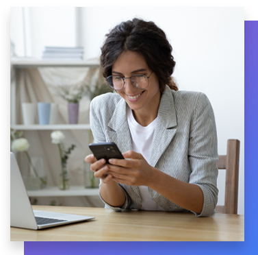 Businesswoman looking at cell phone