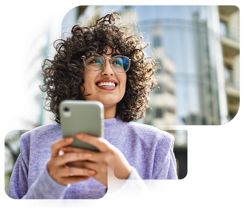 Smiling woman holding mobile phone